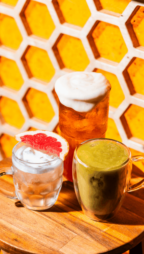 Photograph of a colourful cocktail selection set upon a table in Smoke and Mirrors bar, London, Deptford.